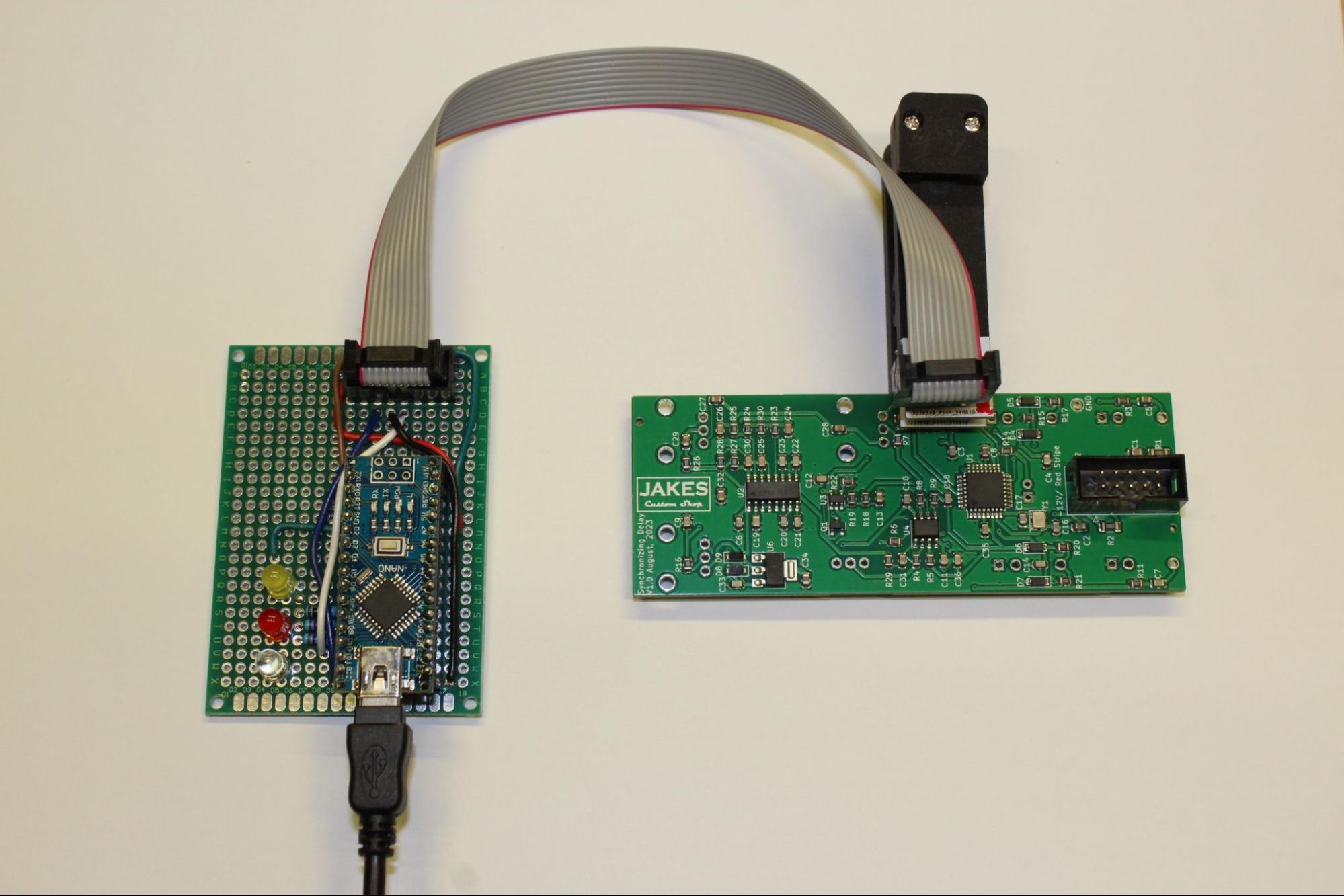 Left: Arduino Nano Based ISP Programer, Right: Delay module PCB and pogo-pin clip ISP connector